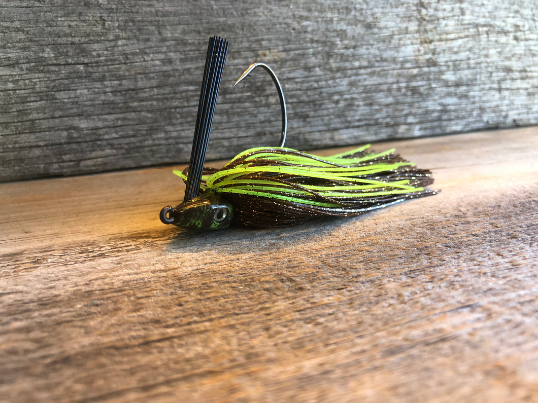 The brown has a gold fleck and then having the chartreuse strands makes this jig visible in stained water. se